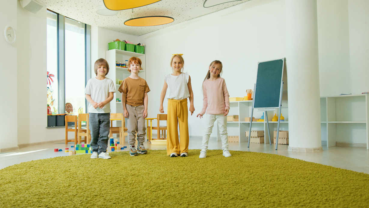 Smiling Children Standing Inside the Classroom